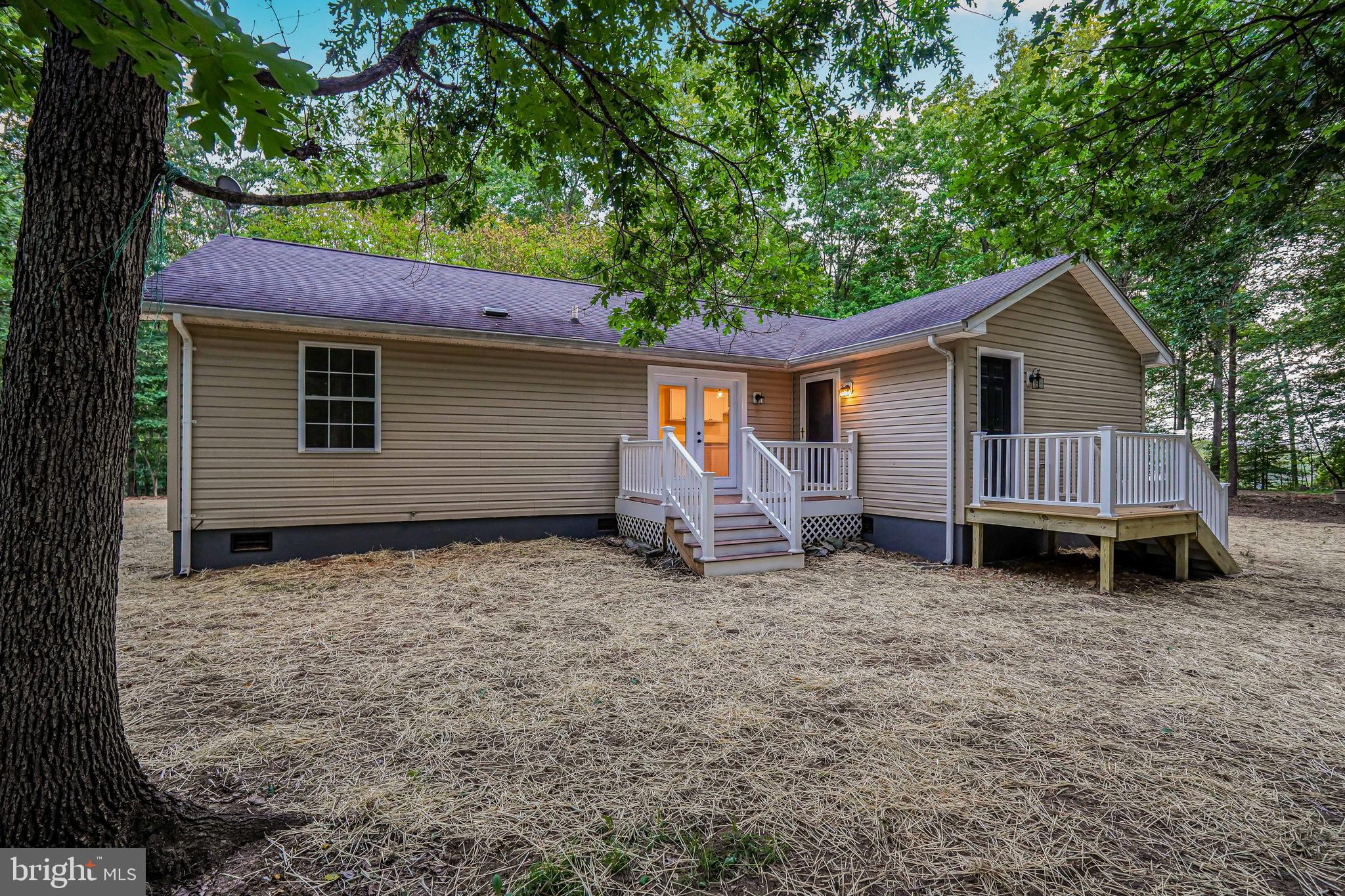 767 Loving Road Zion Crossroads, VA 22942 - Photo 25 of 33 a view of a house with a yard and wooden fence