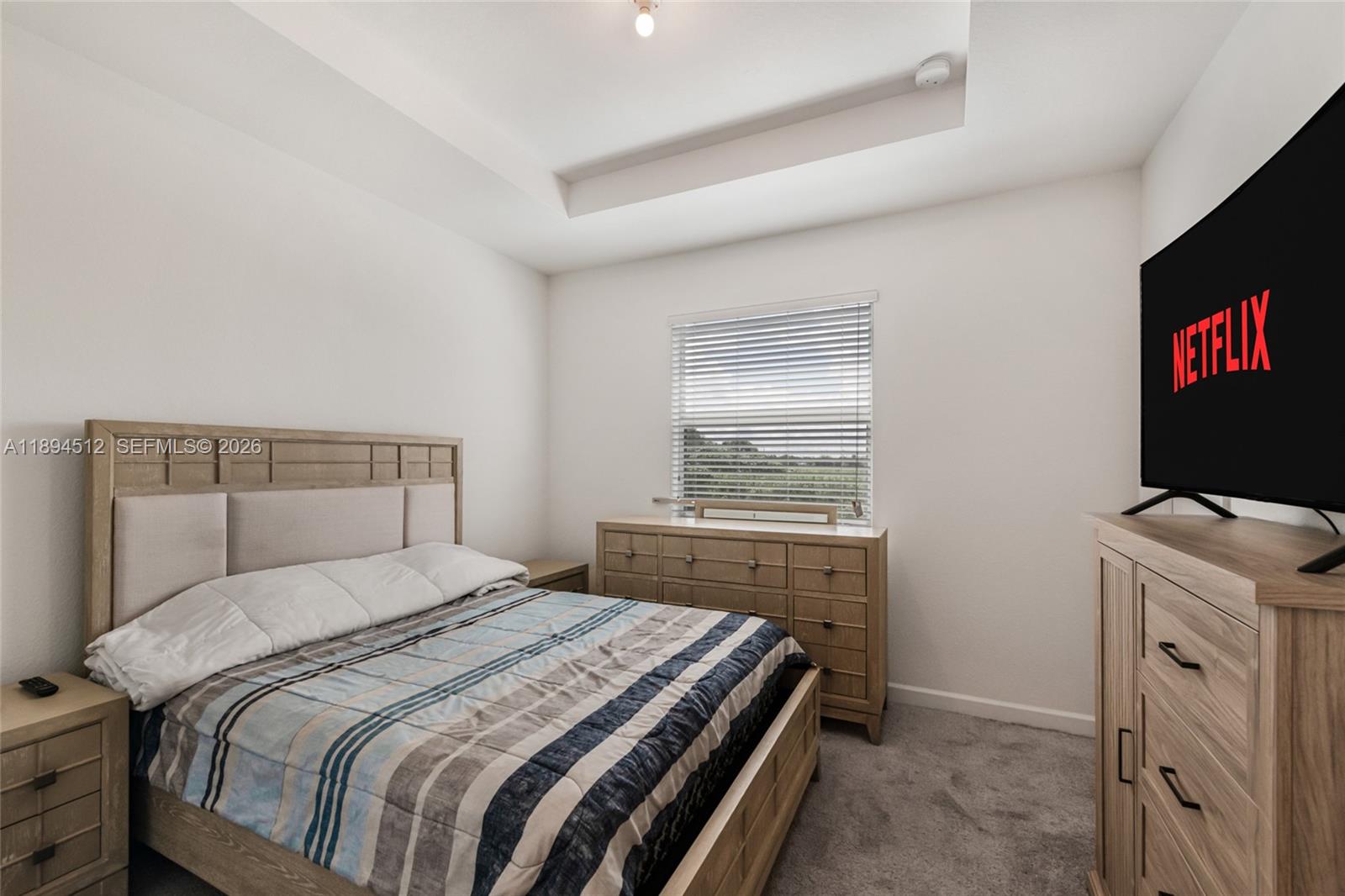 29254 Southwest 163rd Court Homestead, FL 33033 - Photo 12 of 29 a bedroom with a bed and a dresser