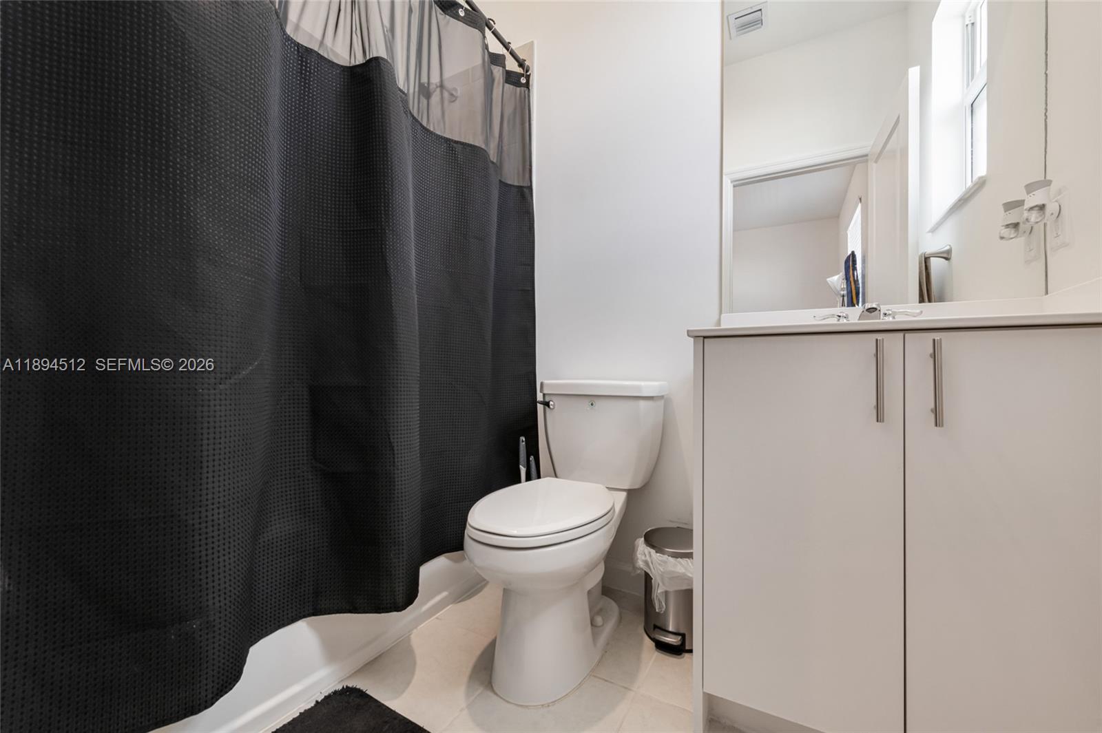 29254 Southwest 163rd Court Homestead, FL 33033 - Photo 22 of 29 a bathroom with a toilet and a sink