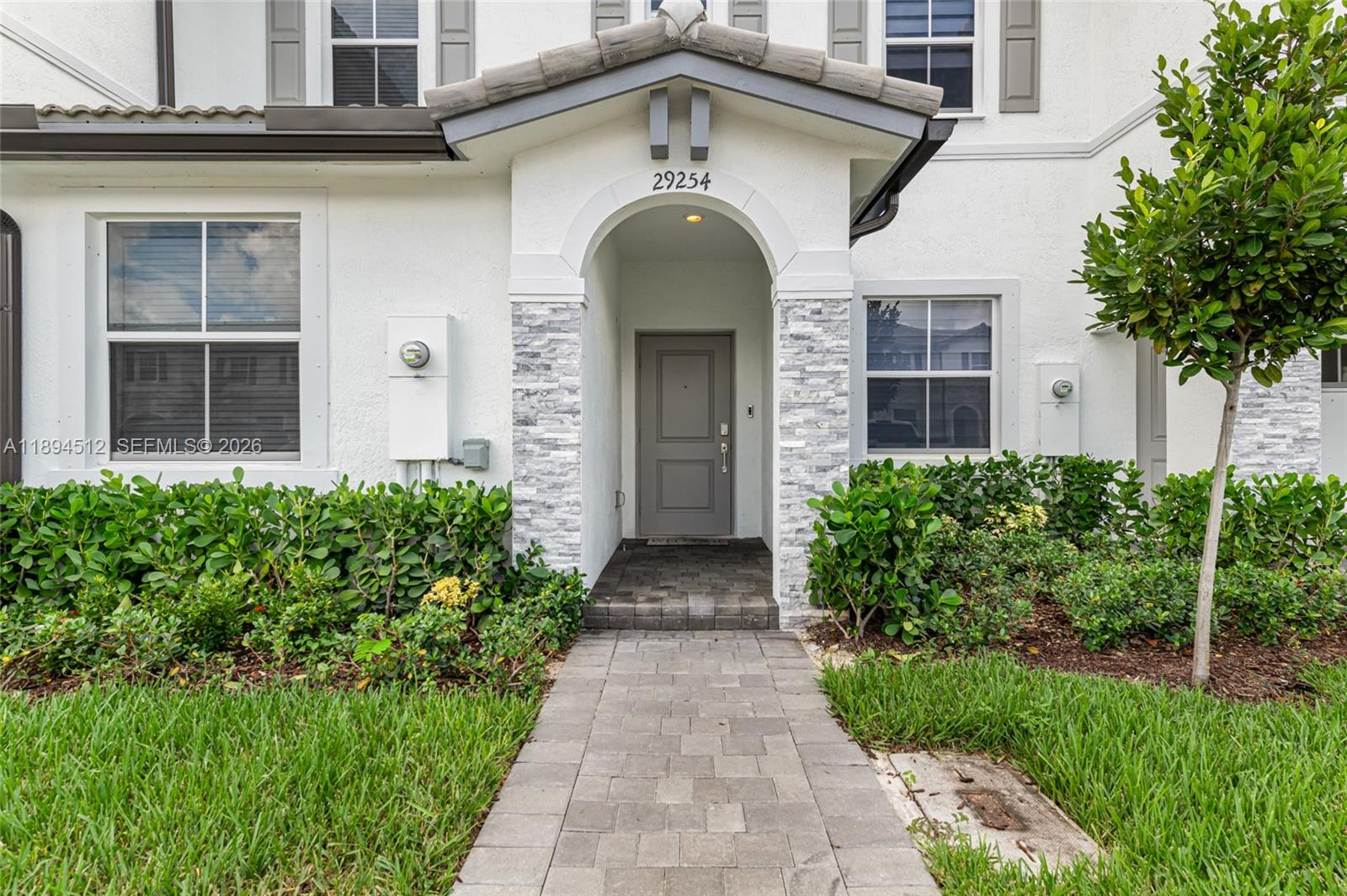 29254 Southwest 163rd Court Homestead, FL 33033 - Photo 27 of 29 a front view of a house with garden