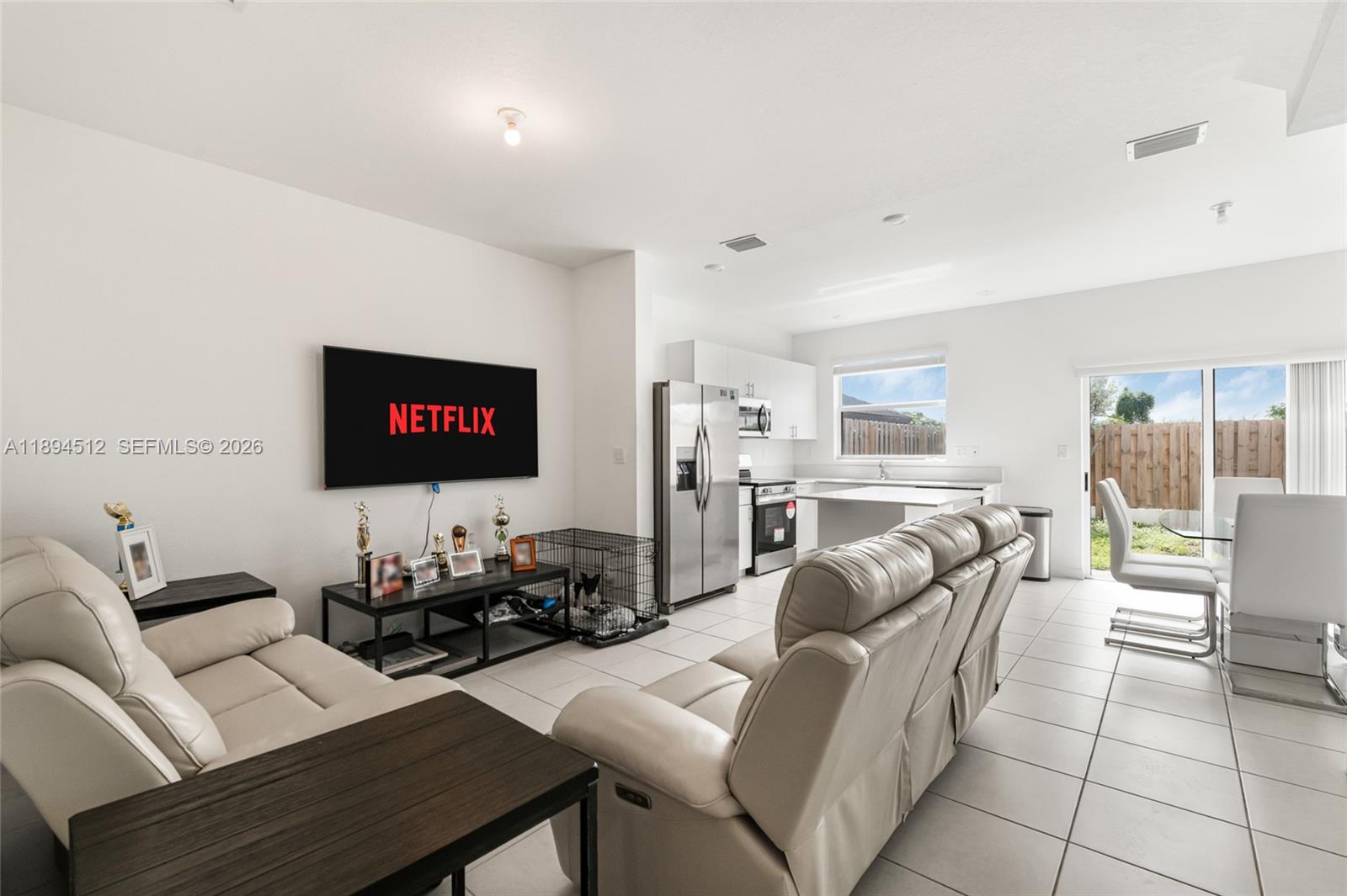 29254 Southwest 163rd Court Homestead, FL 33033 - Photo 4 of 29 a living room with furniture and a flat screen tv