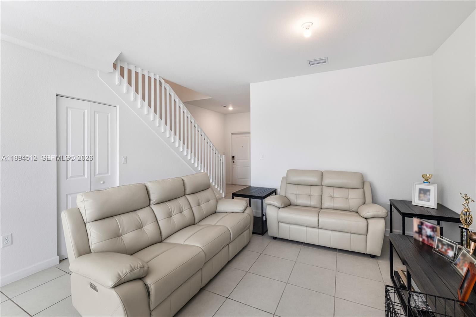 29254 Southwest 163rd Court Homestead, FL 33033 - Photo 5 of 29 a living room with furniture and stairs