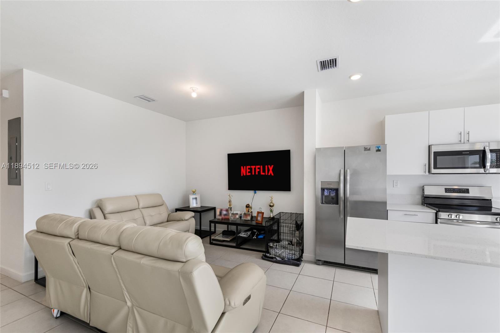 29254 Southwest 163rd Court Homestead, FL 33033 - Photo 7 of 29 a living room with furniture and a flat screen tv
