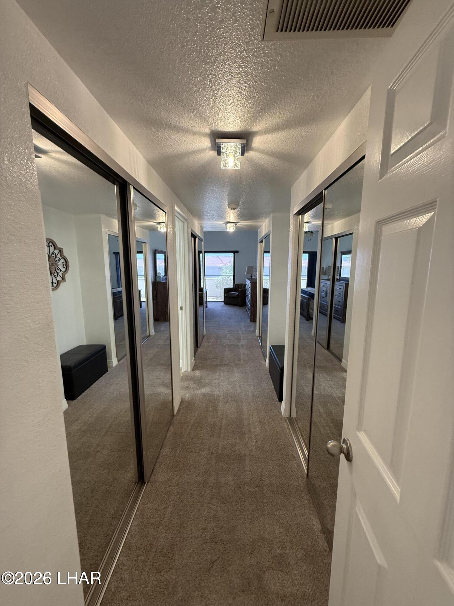 375 London Bridge Road, Unit 35 Lake Havasu City, AZ 86403 - Photo 23 of 43 ENTRY INTO MASTER BEDROOM AND MULTIPLE CLOSETS