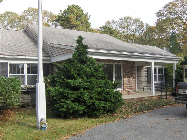 110 Round Cove Road Chatham, MA 02633 - Photo 14 of 16 a house view with a garden space