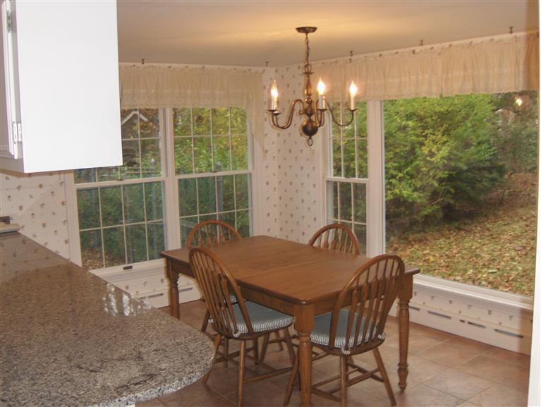 110 Round Cove Road Chatham, MA 02633 - Photo 4 of 16 a view of a dining room with furniture window and outside view