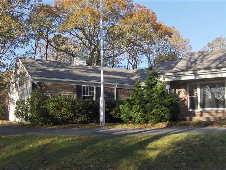 110 Round Cove Road Chatham, MA 02633 - Photo 8 of 16 front view of house with a yard and potted plants