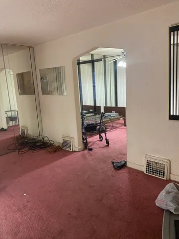 a view of a livingroom with furniture and windows