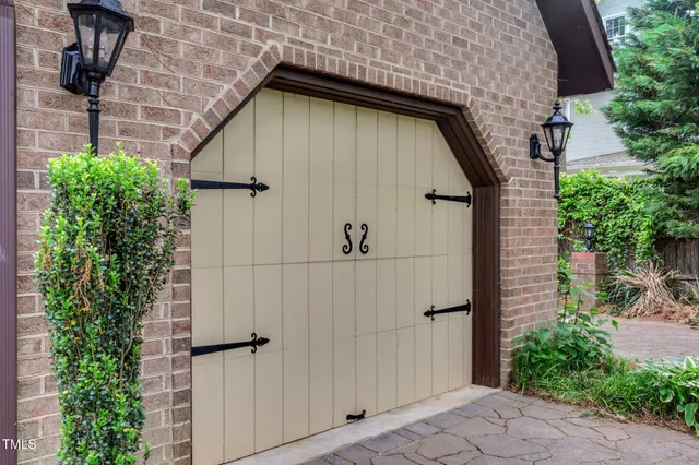 an aerial view of a house with a yard and lake view