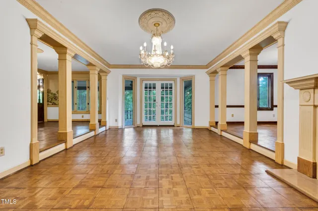 a view of entryway livingroom and hall with wooden floor