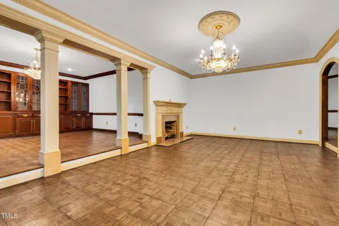 a view of an empty room with a fireplace