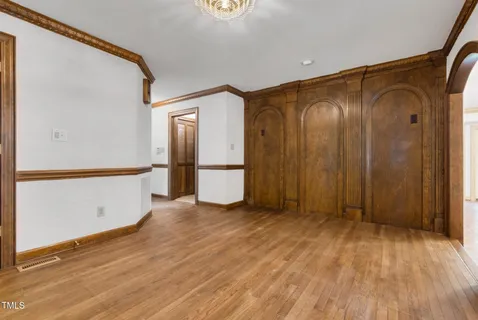 a large kitchen with a large window and cabinets