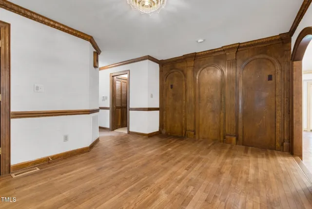 a large kitchen with a large window and cabinets
