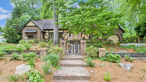 a view of house with garden and pathway