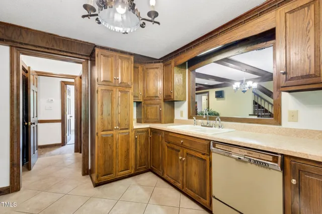 an empty room with a fireplace and wooden floor