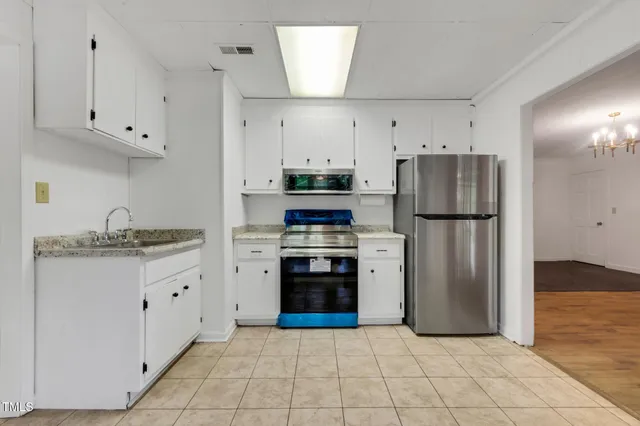 a view of a garden with large trees