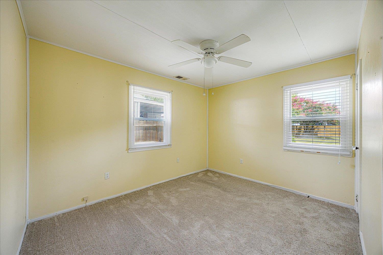 4690 Montgomery Road Millington, TN 38053 - Photo 18 of 26 Empty room featuring light colored carpet, ceiling fan, and ornamental molding