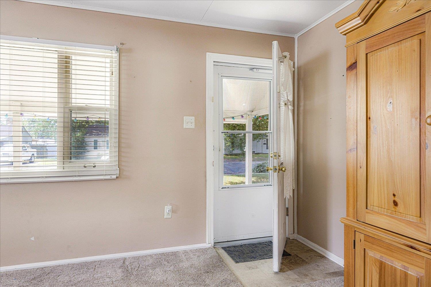 4690 Montgomery Road Millington, TN 38053 - Photo 7 of 26 Entryway with ornamental molding and carpet