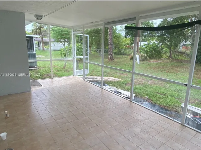 a view of a room with porch and a patio