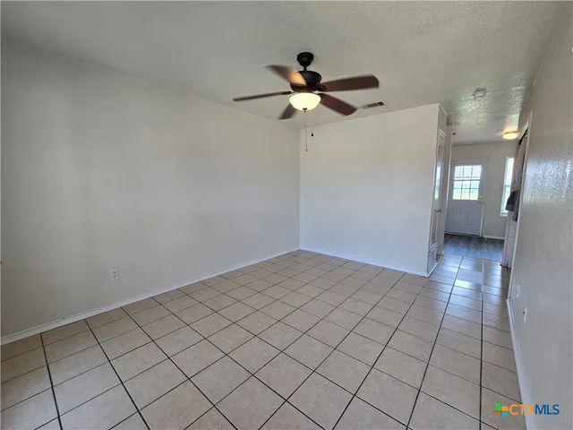a view of an empty room and window