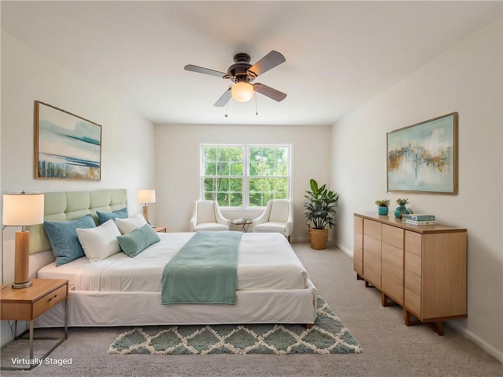 4055 Tecumseh Trail Conley, GA 30288 - Photo 14 of 30 a bedroom with a large bed and a window