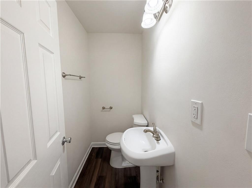 4055 Tecumseh Trail Conley, GA 30288 - Photo 19 of 30 a bathroom with a sink a mirror and toilet