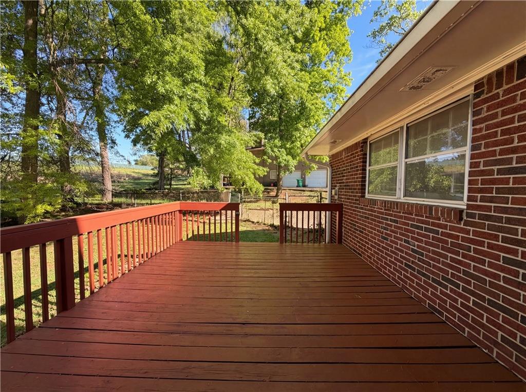 4055 Tecumseh Trail Conley, GA 30288 - Photo 26 of 30 a balcony with wooden floor