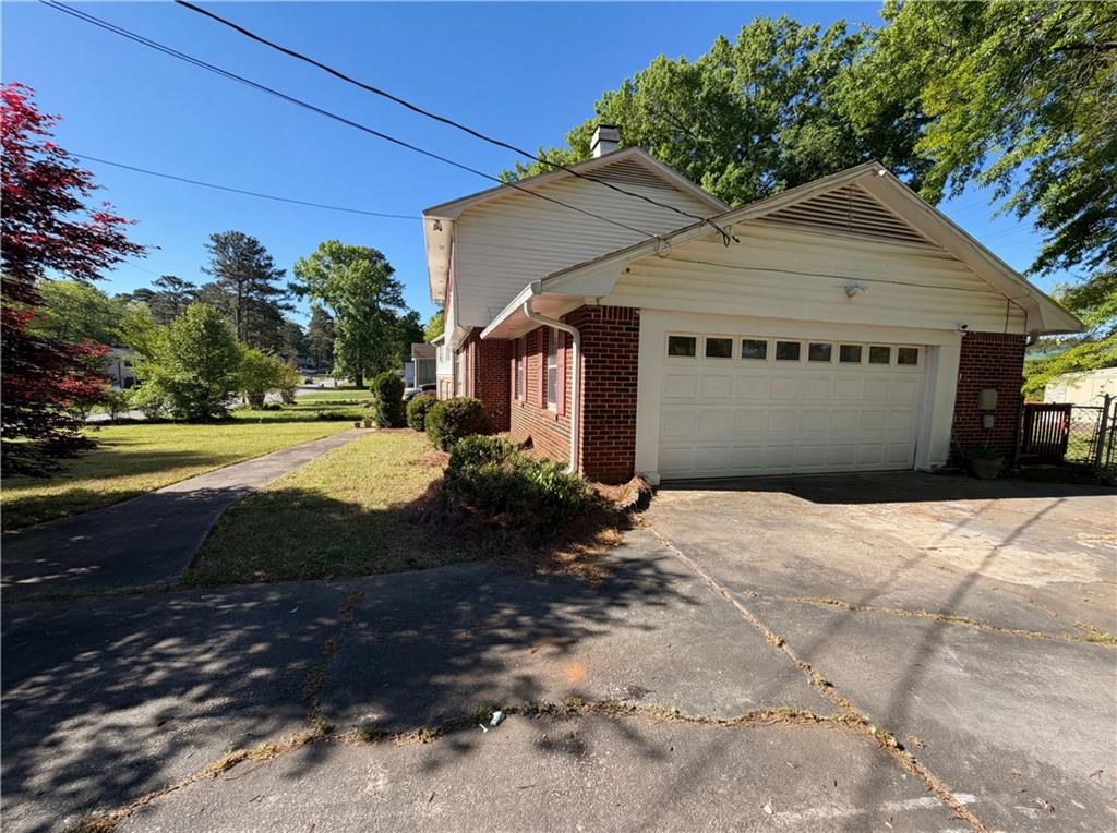 4055 Tecumseh Trail Conley, GA 30288 - Photo 27 of 30 a front view of a house with a yard