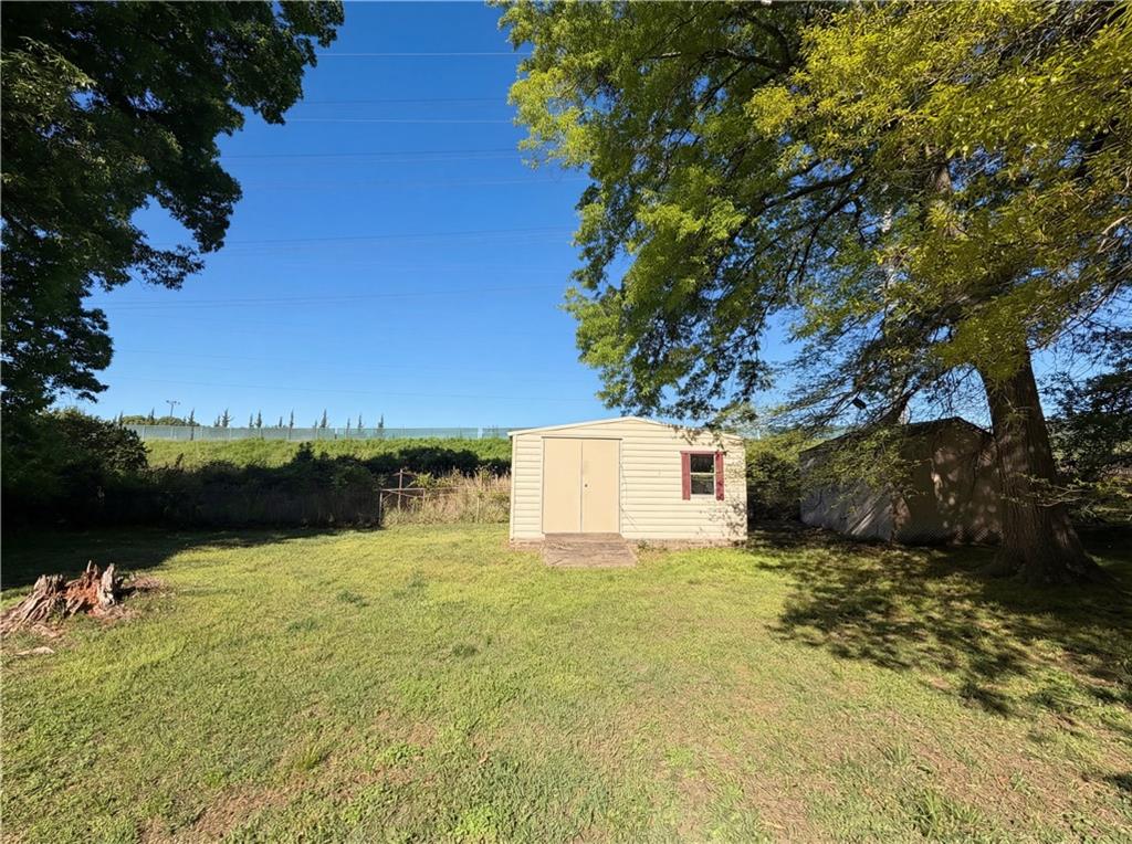 4055 Tecumseh Trail Conley, GA 30288 - Photo 29 of 30 a view of a lake with a house in the background