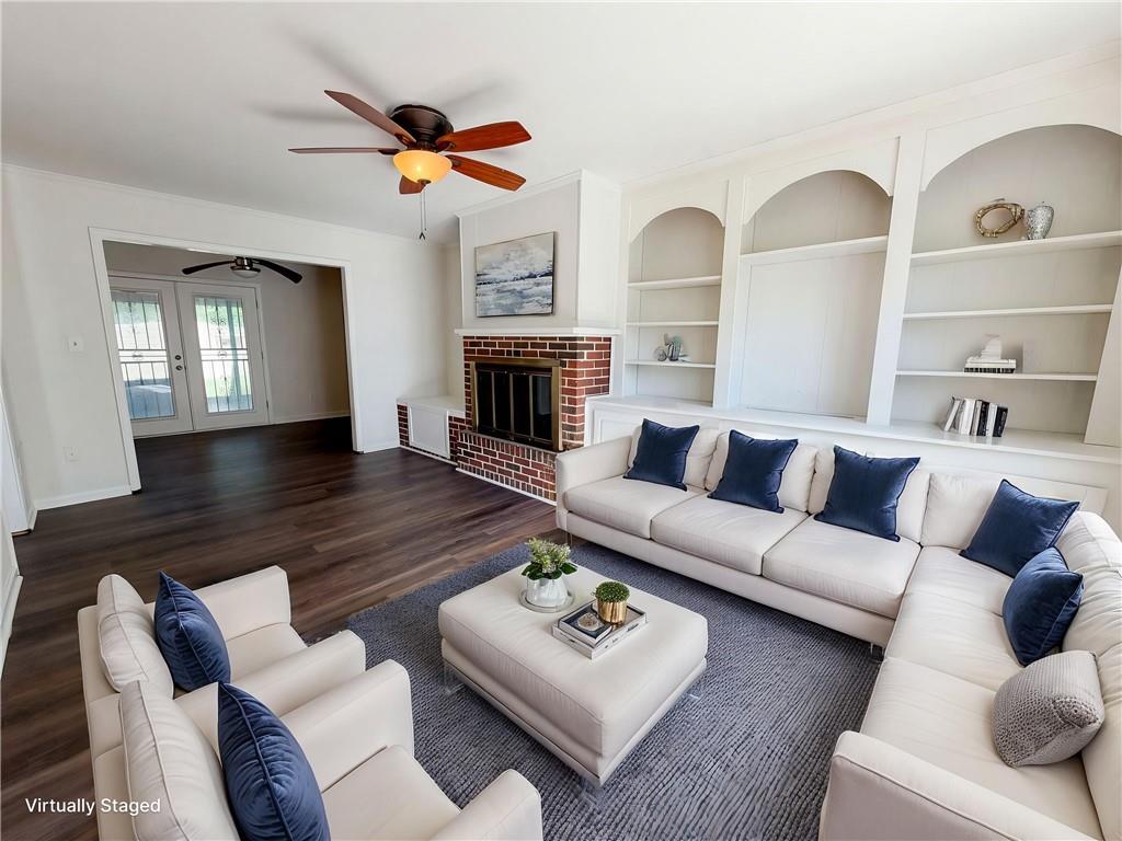 4055 Tecumseh Trail Conley, GA 30288 - Photo 3 of 30 a living room with furniture ceiling fan and a fireplace