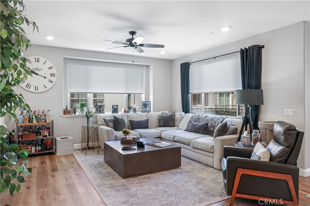 5604 Altamura Way, Unit 11 Fontana, CA 92336 - Photo 1 of 51 a living room with furniture and a chandelier
