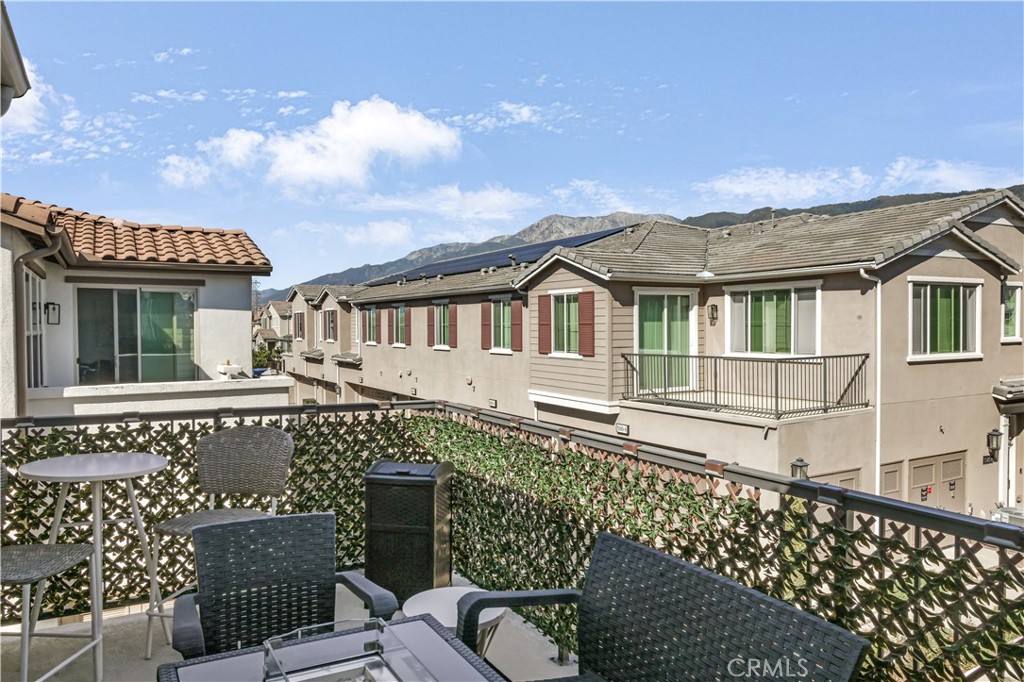 5604 Altamura Way, Unit 11 Fontana, CA 92336 - Photo 17 of 51 a view of a house with a wooden deck