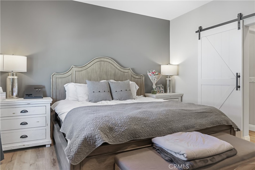 5604 Altamura Way, Unit 11 Fontana, CA 92336 - Photo 24 of 51 a bedroom with a bed and a dresser