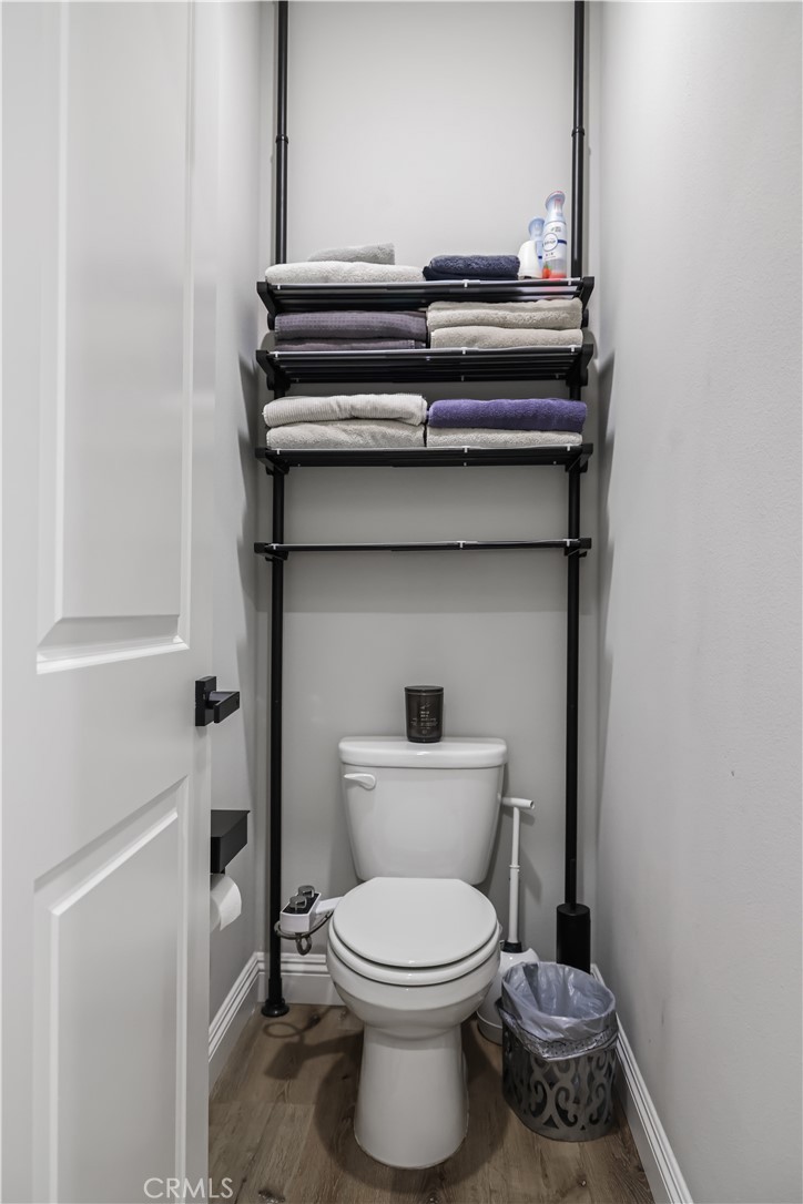 5604 Altamura Way, Unit 11 Fontana, CA 92336 - Photo 28 of 51 a bathroom with a toilet and a sink