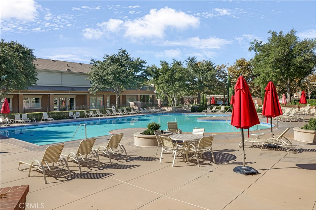 5604 Altamura Way, Unit 11 Fontana, CA 92336 - Photo 41 of 51 a view of backyard with swimming pool and furniture