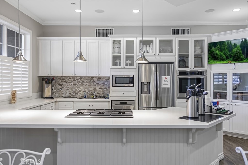 5604 Altamura Way, Unit 11 Fontana, CA 92336 - Photo 45 of 51 a kitchen with stainless steel appliances a sink and a refrigerator