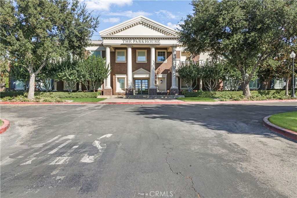 5604 Altamura Way, Unit 11 Fontana, CA 92336 - Photo 49 of 51 a front view of a house with a yard