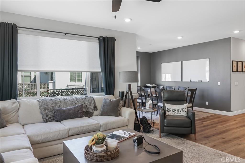 5604 Altamura Way, Unit 11 Fontana, CA 92336 - Photo 10 of 51 a living room with furniture and a large window