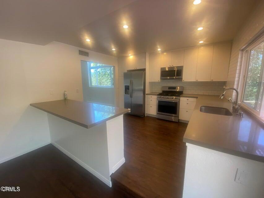 5307 Maple View Circle Camarillo, CA 93012 - Photo 2 of 7 a kitchen with stainless steel appliances granite countertop a sink a stove top oven a counter space and cabinets