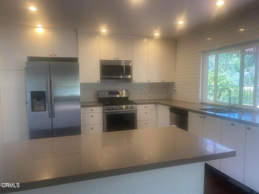 5307 Maple View Circle Camarillo, CA 93012 - Photo 3 of 7 a kitchen with a stove a sink and a refrigerator