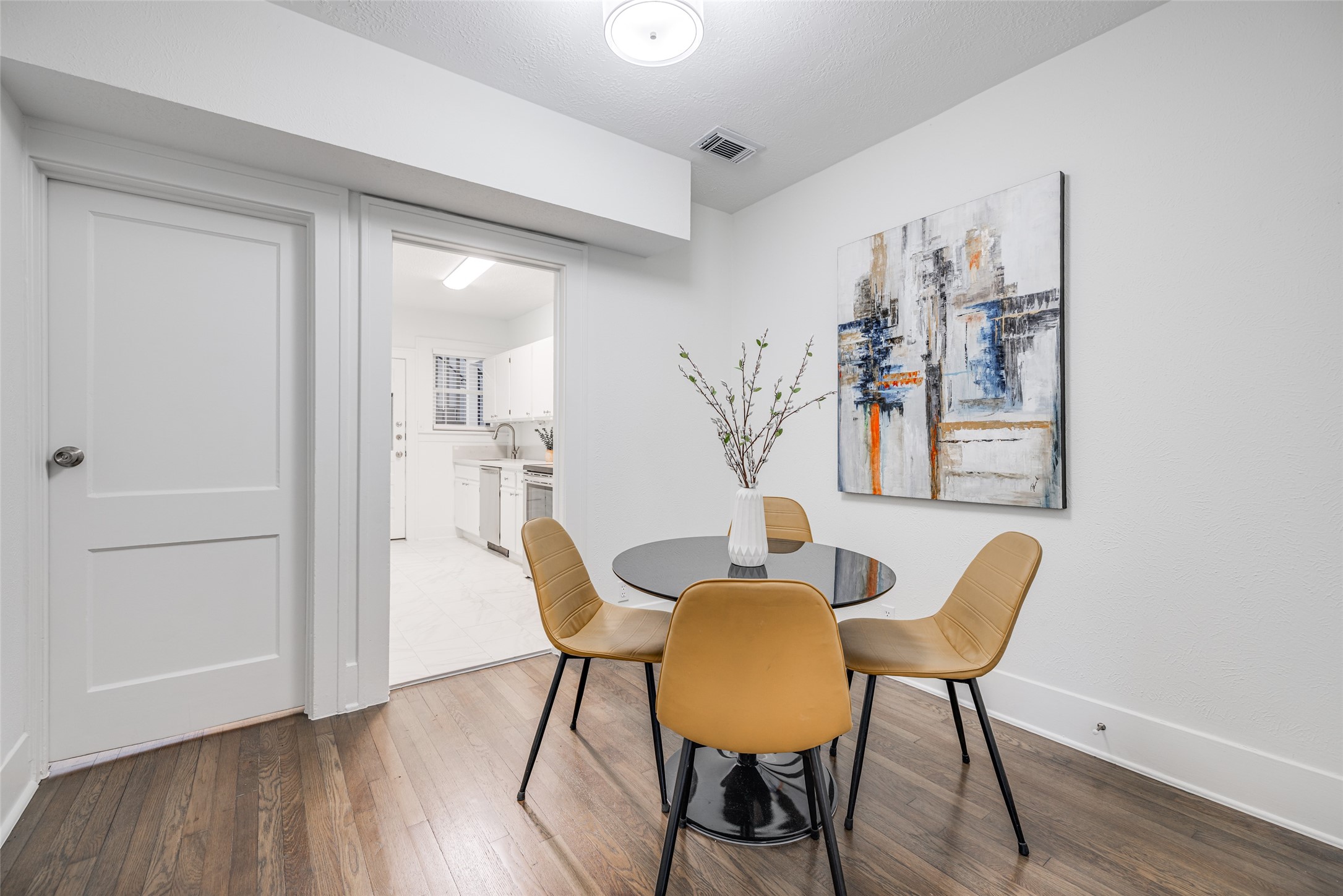 605 Bomar Street, Unit 2 Houston, TX 77006 - Photo 16 of 27 a view of a dining room with furniture and wooden floor