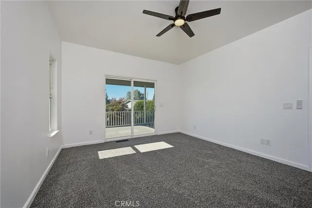 an empty room with a empty space and windows