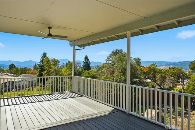 a view of a balcony with wooden floor