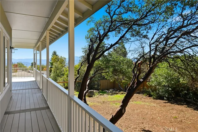 a view of balcony with wooden floor