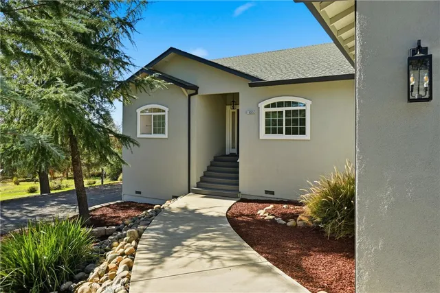a front view of a house with garden