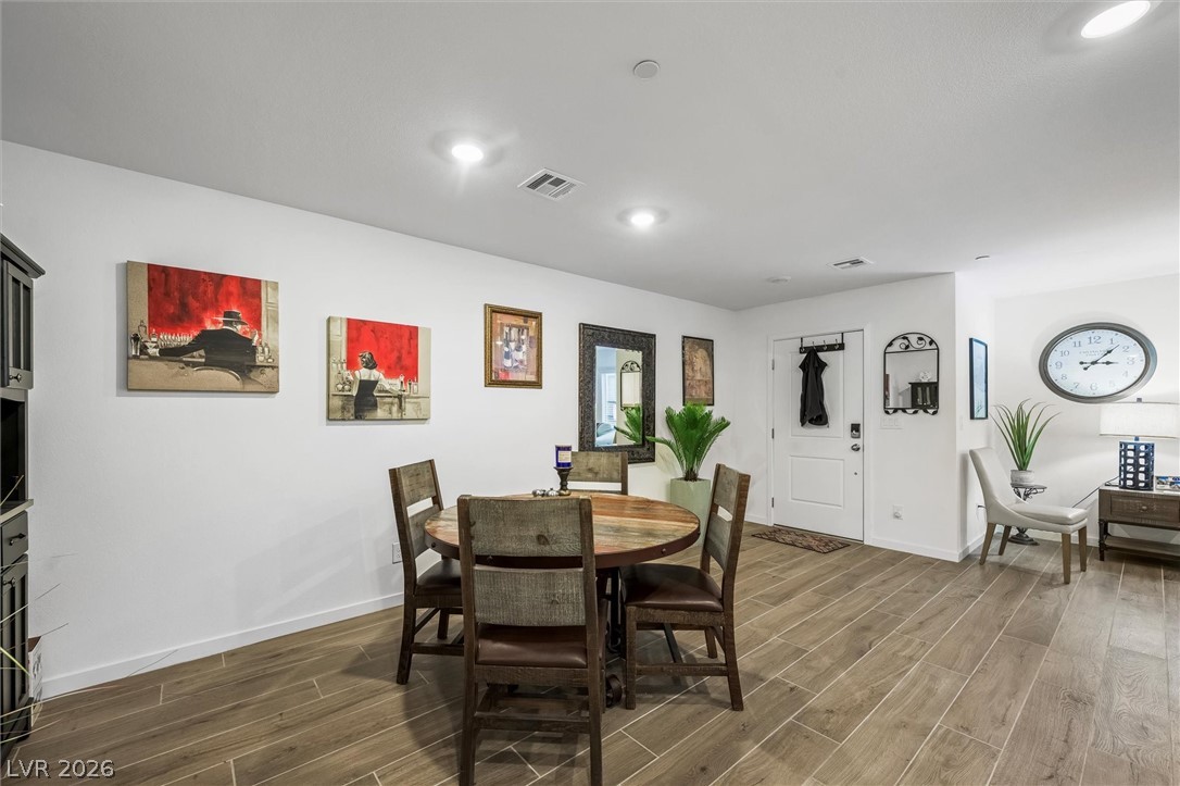175 Hazel Heights Henderson, NV 89011 - Photo 13 of 55 Dining space with wood finish floors and recessed lighting