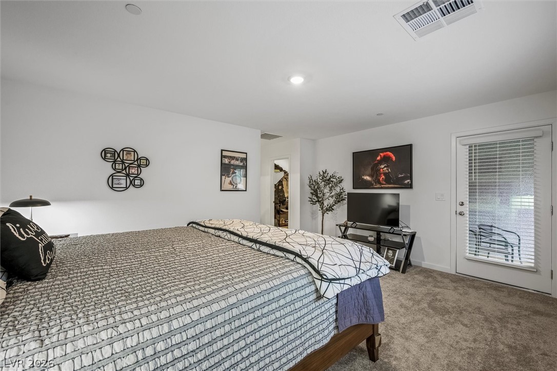 175 Hazel Heights Henderson, NV 89011 - Photo 19 of 55 Carpeted bedroom with a spacious closet and baseboards