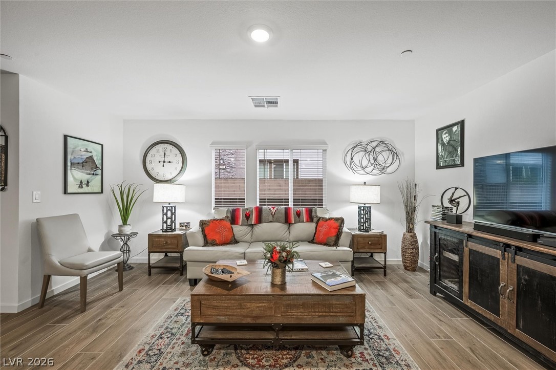 175 Hazel Heights Henderson, NV 89011 - Photo 3 of 55 Living room featuring wood finished floors and baseboards