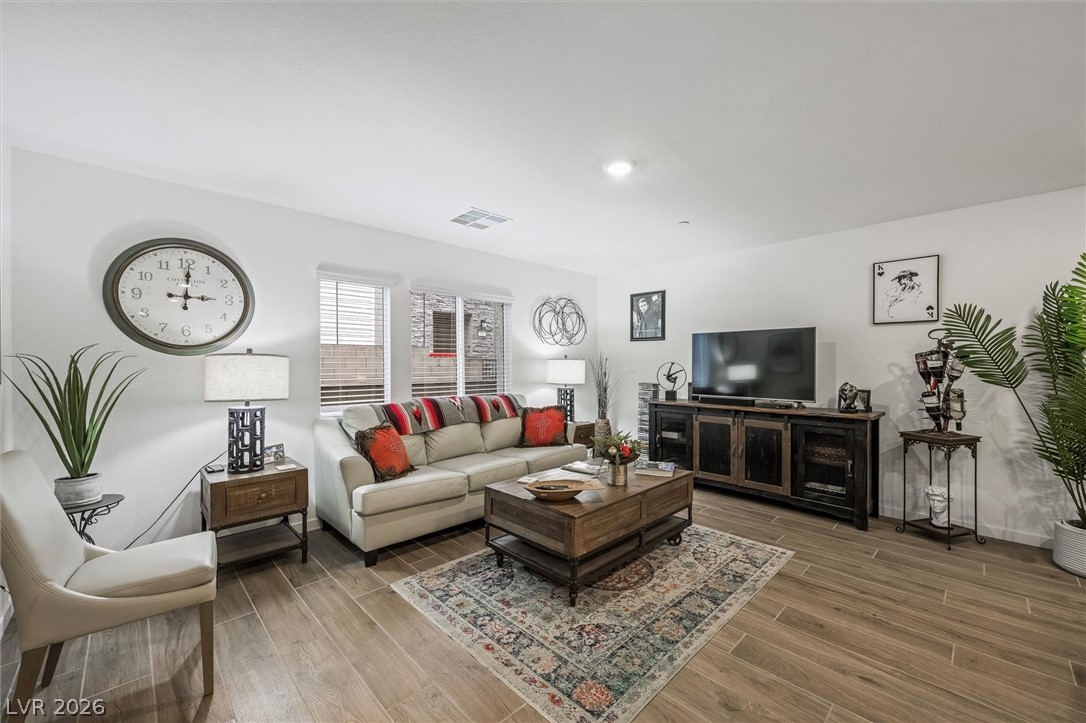 175 Hazel Heights Henderson, NV 89011 - Photo 4 of 55 Living room with wood finish floors and baseboards