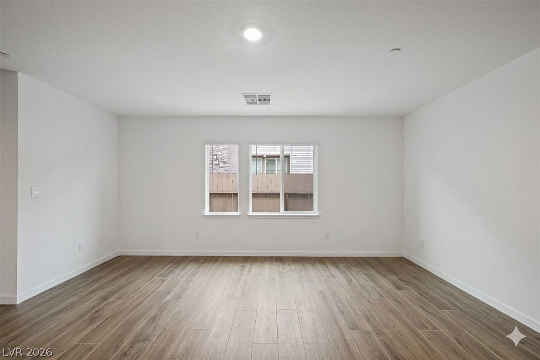 175 Hazel Heights Henderson, NV 89011 - Photo 46 of 55 Spare room with baseboards and wood finished floors